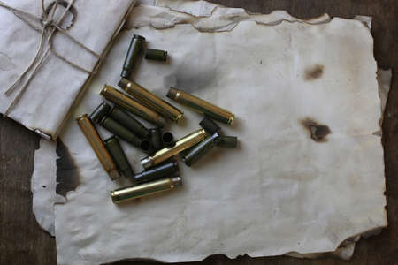 bullet and retro paper on the tableの写真素材