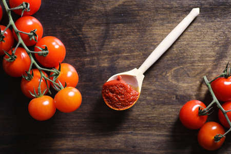 Branch with fresh cherry tomatoes. Ripe red tomatoes. Tomatoes aの写真素材