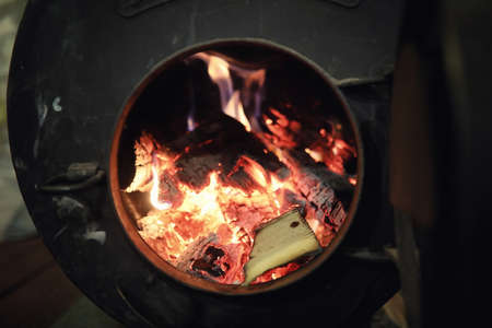 Wood burning stove. Firewood for furnace heating. Warehouse forの写真素材