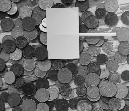 Coins in a jar on the floor. Accumulated coins on the floor. Sav