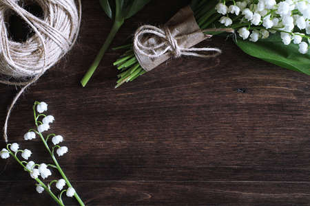 Bouquet of lilies of the valley on a tableの写真素材