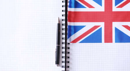 Learning foreign languages. Notepad for entries and a flag. Langの写真素材