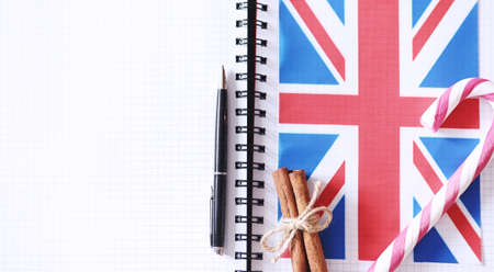 Learning foreign languages. Notepad for entries and a flag. Langの写真素材
