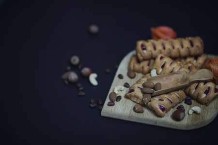 Set for breakfast. Sweets and pastries with nuts for tea on a blの写真素材