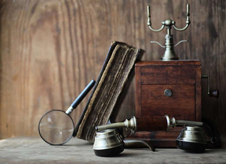 Old telephone and retro book on a woodの写真素材