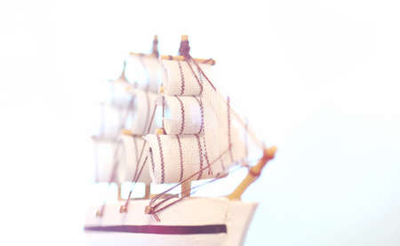 Old wooden ship with sails and masts toy on a stand. Vintage andの写真素材