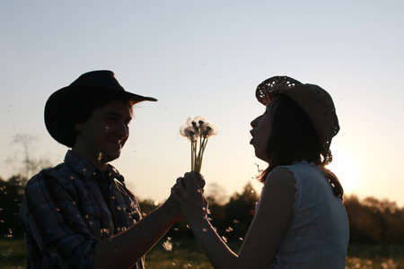 Cute couple on a walk by the countrysideの写真素材