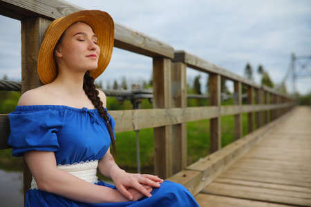 Girl in the countryside in the eveningの写真素材