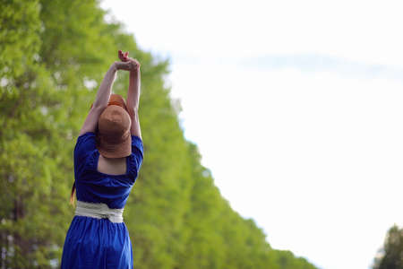 Girl in the countryside in the eveningの写真素材
