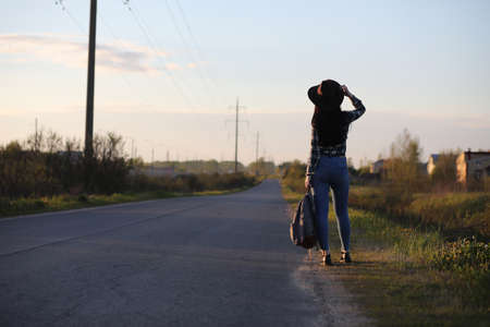 A girl travels the summer in the countryの写真素材