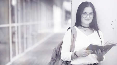 Young girl student on the streetの写真素材