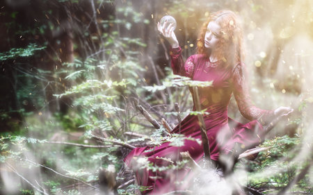 Witch ritual in a forestの写真素材