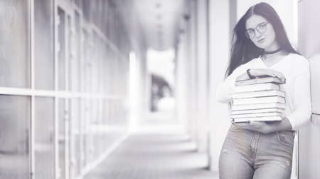 Young girl student on the streetの写真素材
