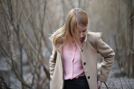 Cute blonde in a city parkの写真素材