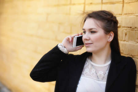 Cute girl in an autumn parkの写真素材