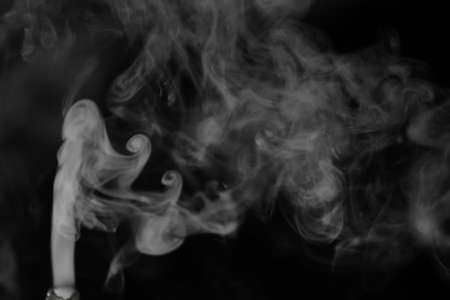White smoke on a black background. Texture of smoke. Clubs of whの写真素材