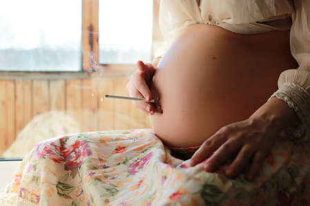 Beautiful girl pregnant blondeの写真素材