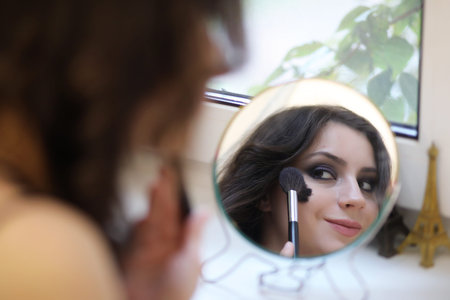 Beautiful girl doing makeup