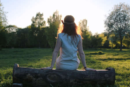 A girl on a walk in an autumn park. Young red-haired girl in theの写真素材