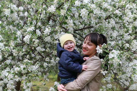 Beautiful girl in a park with childrenの写真素材