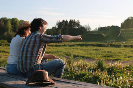 Cute couple on a walk by the countrysideの写真素材
