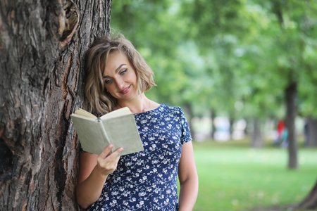 Beautiful girl in the summer park