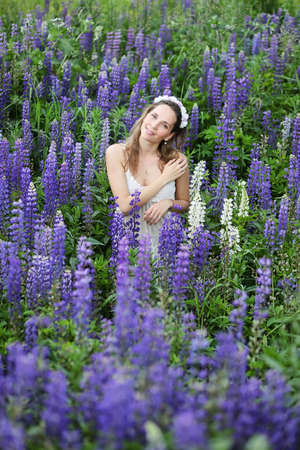 Girl with a bouquet of blue flowersの写真素材