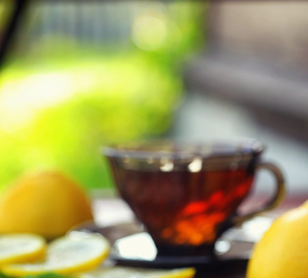 Tea with lemon and mint in nature. A cup of hot mint tea with leの写真素材