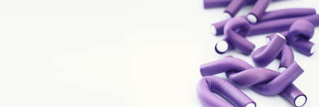 Female colored curlers and hair pins on the table
の写真素材