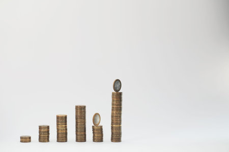 A potted plant and a pile of coins a concept of income