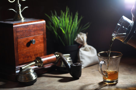 Brewing tea on a wooden table in the morning