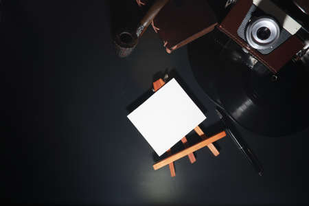 Vinyl plate and retro camera on the tableの写真素材