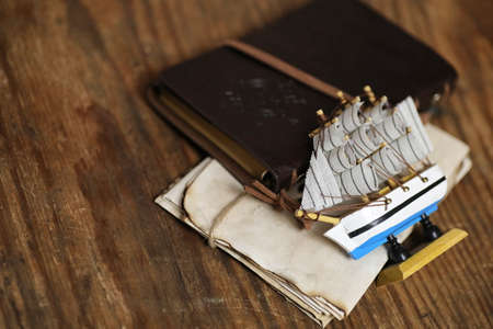Old wooden ship with sails and masts toy on a stand. Vintage and retro toysの写真素材