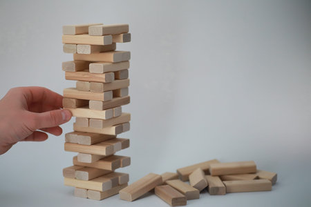 Board game jenga tower of light wood sticks