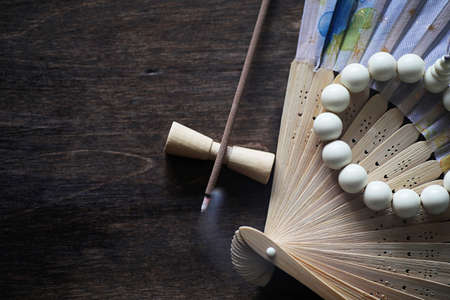 Different objects with traditional religious oriental on a wooden backgroundの写真素材