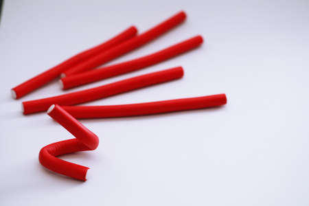 Female colored curlers and hair pins on the tableの写真素材