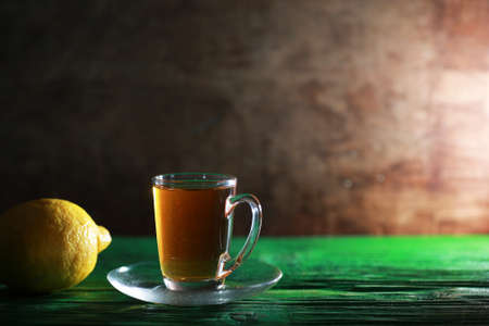 Brewing tea on a wooden table in the morningの写真素材