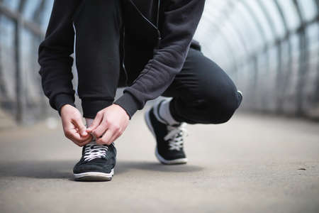 A man in sportswear playing sports outdoorsの写真素材