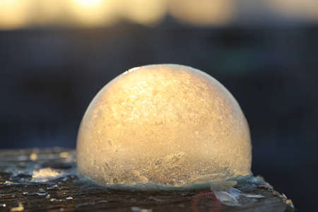 Soap bubbles freeze in the cold. Winter soapy water freezes in air.の写真素材