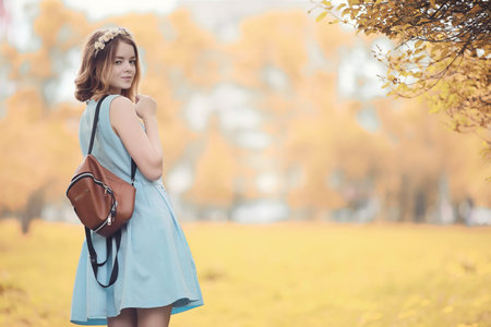 Young girl on a walk in the autumnの写真素材