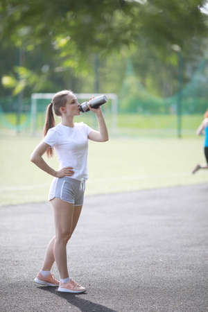 Girl and sport lifestyle doing exercisesの写真素材