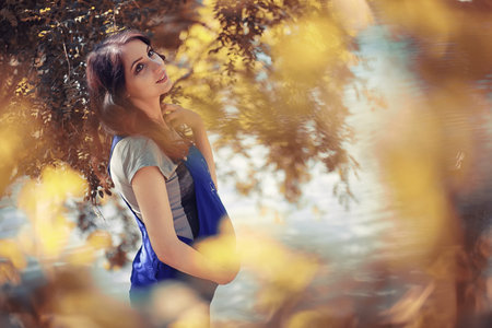 Pregnant woman on a walk in the park