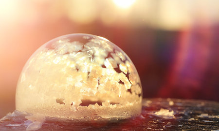 Soap bubbles freeze in the cold. Winter soapy water freezes in air.
