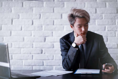 Young Asian businessman in white shirt and tieの写真素材