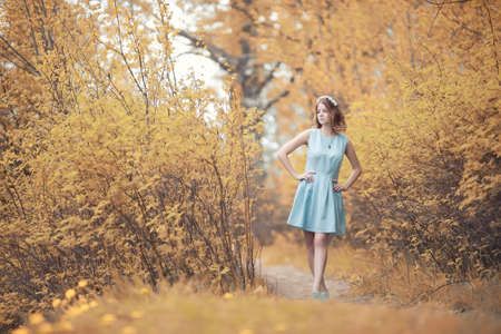 Young girl on a walk in the autumnの写真素材