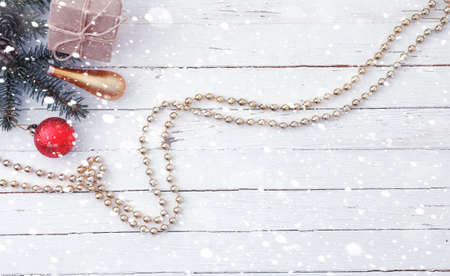 New Year's background. Spruce branches on a wooden table. Ornaments for the New Year tree. Christmas conceptの写真素材