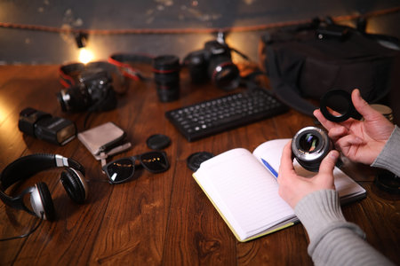 The photographer's desk, digital camera accessories and lenses