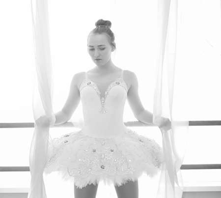 Young ballet dancer on a warm-up. The ballerina is preparing toの写真素材