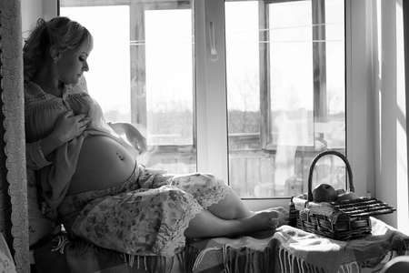 A beautiful blonde pregnant girlの写真素材