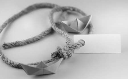 white sticker with thick braided rope and ship paper origamiの写真素材